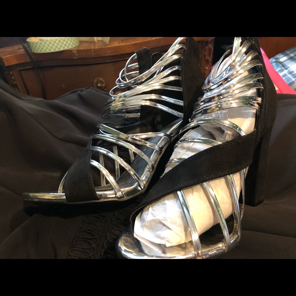 Black and silver platform shoes.